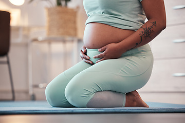 Image showing Pregnant, yoga and black woman on mat, stomach and training for healthcare, prenatal and wellness. Pregnancy, African American female and lady with tummy, floor and meditation with pilates training