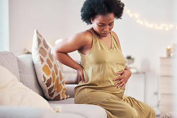 Image showing Back pain, spine and pregnant woman with healthcare stress, problem or risk on sofa in her living room. Backache, stomach and pregnancy mother with medical emergency worry, labor or sick on her couch