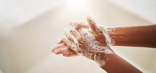 Image showing Washing hands, soap and water for cleaning, hygiene and wellness in bathroom lens flare. Liquid, hand or skin care for bacteria, germs or virus protection in sink for healthcare and safety background