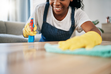 Image showing Hand, cleaning and latex gloves with a black woman using a cloth in a home for hygiene as a housekeeper. Furniture, bacteria and chemical with a female cleaner working in housekeeping in an apartment