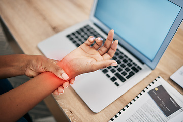 Image showing Pain, working and wrist of black woman with laptop and injury, joint inflammation and arthritis from typing. Health, medical care and girl holding hand with muscles strain, stress and carpal tunnel