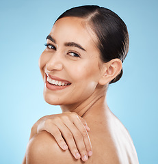 Image showing Skincare, self care and portrait of a model in a studio for beauty, cosmetic and facial treatment. Cosmetics, happy and woman from Brazil with a healthy face routine isolated by a blue background.