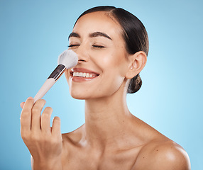 Image showing Face, beauty and makeup brush of woman with eyes closed in studio isolated on blue background. Nose, facial and skincare aesthetic of happy female model with tools for foundation, powder or cosmetics