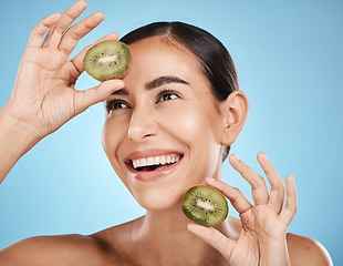 Image showing Kiwi, skincare and woman isolated on studio background for natural beauty, cosmetics and facial product on mockup. Healthy, organic and happy model or person fruits for face, dermatology or vitamin c