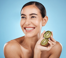 Image showing Kiwi, beauty and woman isolated on studio background for natural skincare, cosmetics and facial product on mockup. Healthy, organic and happy model or person fruits for face or dermatology vitamin c