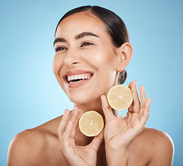 Image showing Skin care, lemon and woman happy about beauty cosmetics, dermatology and wellness. Aesthetic model for natural vitamin c facial glow, nutrition diet and healthy smile or face detox on blue background