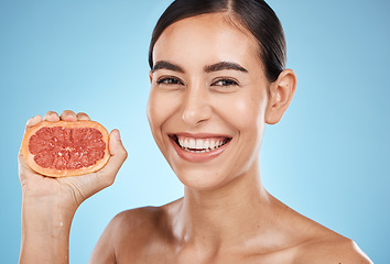 Image showing Skin care, beauty and grapefruit squeeze woman portrait for dermatology, natural cosmetic and wellness. Face of aesthetic model for fruit glow facial, nutrition diet and healthy smile blue background