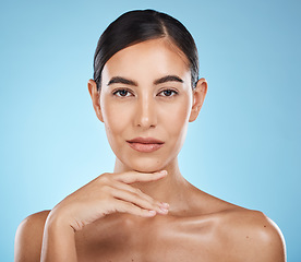 Image showing Face, portrait and beauty skincare of woman in studio isolated on a blue background. Aesthetics, makeup and cosmetics of female model with healthy, glowing or flawless skin after spa facial treatment