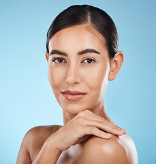 Image showing Portrait, face and beauty skincare of woman in studio isolated on a blue background. Aesthetics, makeup and cosmetics of female model with healthy, glowing or flawless skin after spa facial treatment