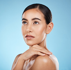 Image showing Skincare, cosmetics and woman thinking, beauty and dermatology with girl on blue studio background. Makeup, female and girl with decision, daydreaming and grooming routine for smooth and soft skin