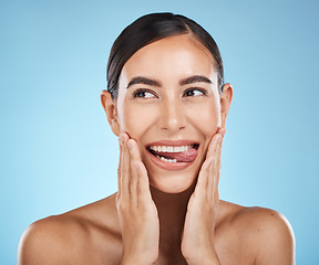 Image showing Face, tongue out and beauty skincare of woman in studio isolated on a blue background. Thinking, makeup or cosmetics of female model with healthy, glowing and flawless skin after spa facial treatment