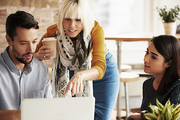 Image showing Laptop, team work or creative people in a meeting planning ideas for our vision or startup development. Collaboration, innovation or woman pointing at research data or strategy with graphic designers