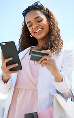 Image showing Phone, credit card and woman in the city doing online shopping, paying debt or on her bank app. Happy, smile and female on a cellphone for a ecommerce retail sale, discount or promotion in town.