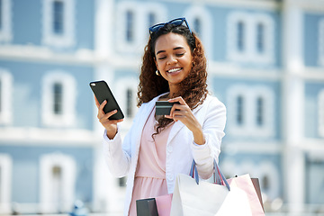 Image showing Shopping, phone and credit card of woman for ecommerce or travel payment for a sale or discount. Person with smile for designer fashion, retail promotion and paper bag for online fintech banking app