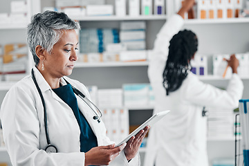 Image showing Pharmacy, inventory and senior woman on digital tablet for checklist, pills and orders. Pharmacist, colleagues and ladies online, internet and search while doing stock at a clinic dispensary together