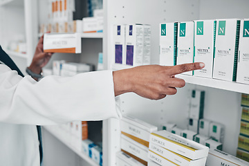 Image showing Pharmacy, pills ad medicine with hands of black woman in store for healthcare, wellness or retail. Product, shopping and medical with pharmacist at drugs outlet for shopping, supplements or inventory