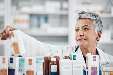Image showing Pharmacy shelf, medicine and senior woman with pills, supplements and medication for prescription in clinic. Wellness, pharmaceutical store and pharmacist check drugs, vitamins and medical products