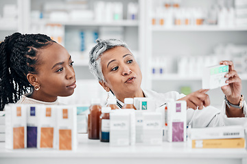 Image showing Pharmacy, help and customer with medicine information at drugstore, advice and label check by friendly worker. Senior lady, pharmacist and black woman consulting for pills, treatment and questions