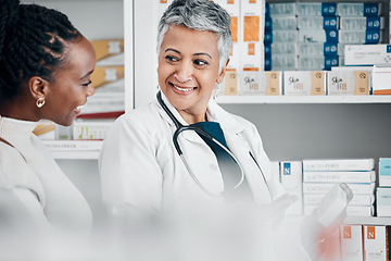 Image showing Pharmacy, service and black woman with pharmacist for advice, help and treatment or medicine choice. Customer, senior doctor and discussion for pharmaceutical information, questions and guidance