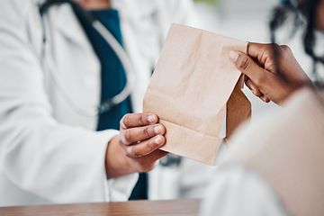 Image showing Pharmacy, medication and pharmacist giving bag to a patient for treatment, cure or remedy. Healthcare, people and woman with a brown paper package from a chemist for medicine in a drugstore or clinic