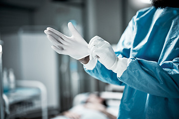 Image showing Hands, latex gloves and surgeon preparing for operation in a consultation room in the hospital. Healthcare, surgical and medical doctor ready for surgery in ER or emergency theatre in medicare clinic