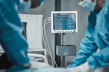 Image showing Monitor, electrocardiogram and doctors in surgery, healthcare and operating for emergency, procedure or teamwork. Medical professionals, team or staff with screen, support or saving a life in theater