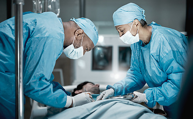 Image showing Healthcare, surgery and doctors in hospital operating room for emergency operation on patient. Health clinic, collaboration or team of medical surgeons working with surgical tools to save life of man