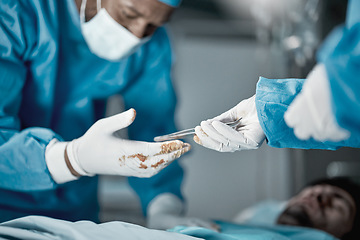 Image showing Hospital, surgery and hands of doctors with tweezers in operating room for emergency operation on patient. Health clinic, teamwork and medical surgeons working with surgical tools to save life of man