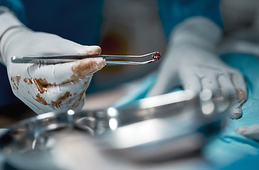 Image showing Surgery, blood and motion blur with the hands of a doctor in a hospital for a medical or life saving operation. Healthcare, emergency or medicine with a surgeon at work in an operating room