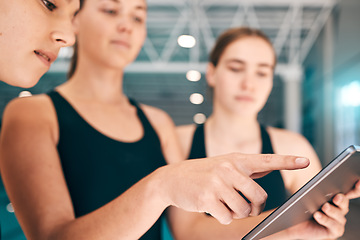 Image showing Young athletes looking at tablet, training data for sports with technology and group of people at indoor swimming pool. UX of digital workout, swimmers learning from teacher and performance analytics