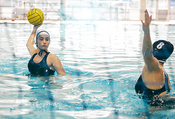 Image showing Water polo athlete, woman and ball in swimming pool, active sports and fitness with action and energy. Competitive, team sport and challenge, training and workout, health motivation and cardio