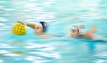 Image showing Water sports, polo and athlete swimming with a ball for a competition, exercise or hobby. Fitness, blur motion and female swimmer training to play a professional sport game or match in a indoor pool.