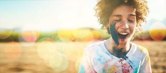 Image showing Boy, outdoor and paint splash on face with mockup space by field, grass or nature for holiday in blurred background. Young happy kid, sunshine and excited smile at park, game or countryside vacation
