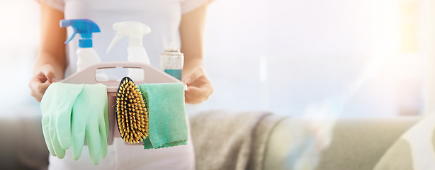 Image showing Hands, cleaning and mockup with a woman housekeeper holding a basket of detergent or disinfectant in a home. Housekeeping, hygiene and mock up with a female cleaner carrying a plastic container