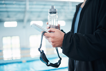 Image showing Man hands, phone texting and swimming pool with goggles, water bottle or communication on social media. Aquatic sports coach, smartphone and typing on screen with mobile app, website or internet chat