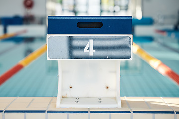 Image showing Sports, swimming and podium number by pool for training, exercise and workout for triathlon competition. Fitness, motivation and four on professional diving board ready for dive, start and race