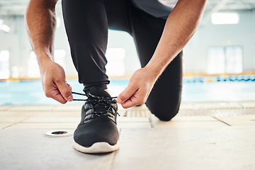 Image showing Lace shoes, swimming coach and man on ground for workout, training and wellness. Closeup guy tie sneakers for pool exercise, sports and water performance for healthy body, fitness goals and footwear