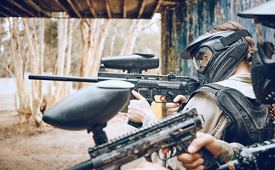 Image showing Paintball, gun and target with people, action and sports outdoor, battlefield and soldier, focus during war game. Extreme sport, team aim weapon and military mission, exercise and fitness