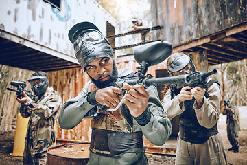 Image showing Paintball, team building and black man soldier target together for military, army and field game training. Exercise, fitness and shooting with battlefield players in a sports event with focus