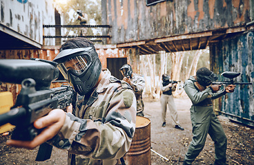 Image showing Paintball gun, team building and soldier group together for military, army and field training. Exercise, fitness and target shooting of a man with battlefield players in sport event with focus