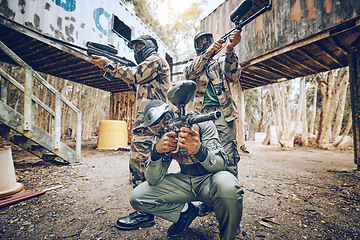 Image showing Paintball teamwork, shooting together and war game with vision, mask or tactical strategy for safety in competition. Military training, team building or group for weapon, formation or friends outdoor