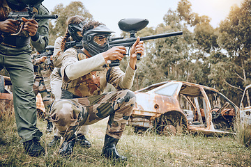 Image showing Target, teamwork and paintball with people in field for sports, fitness and shooting games. War, smoke and community with man gamer playing in camouflage for military, army and competition training