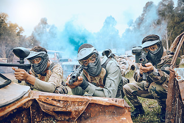 Image showing Paintball gamer, team shooting and soldier group for military, army and field game training. Exercise, fitness and target goal of a men on battlefield together in a sports event outdoor with focus