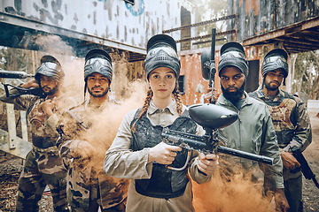Image showing Paintball gun, woman portrait and leader in smoke for a sports game, competition or challenge. Diversity men and strong warrior team for military, soldier or army fight outdoor in war battlefield