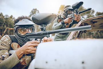 Image showing Paintball gun, man and group with aim, shooting strategy and team formation in military combat game. Army training, warfare games and adventure on battlefield, outdoor challenge and teamwork friends