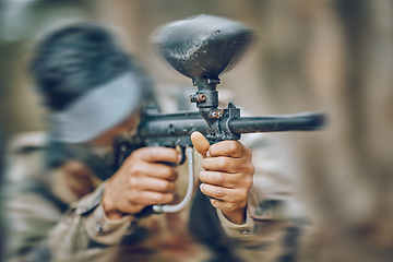 Image showing Paintball, gun and target with man, action and sports outdoor, battlefield and soldier, focus during war game. Extreme sport, aim weapon and military mission, exercise and fitness with motion blur