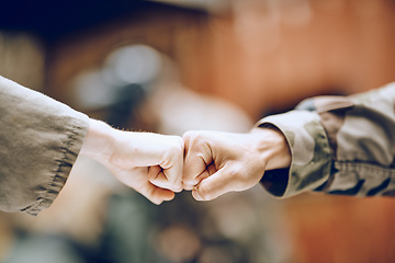 Image showing Hands, soldier and fist bump for partnership, deal or agreement in collaboration or trust together. Hand of army people touching fists in support for friendship, community or unity in solidarity