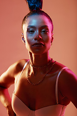 Image showing Portrait, beauty and neon with a model black woman in studio on a kaleidoscope background for fashion. Art, makeup and style with an attractive young female posing indoor for culture or cosmetics