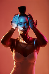 Image showing Portrait, fashion and neon with a model black woman in studio on a kaleidoscope background for beauty. Art, makeup and style with an attractive young female posing indoor for culture or cosmetics