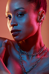 Image showing Portrait, makeup and closeup with a model black woman in studio on a neon background for beauty. Art, kaleidoscope and style with an attractive young female posing indoor for culture or cosmetics